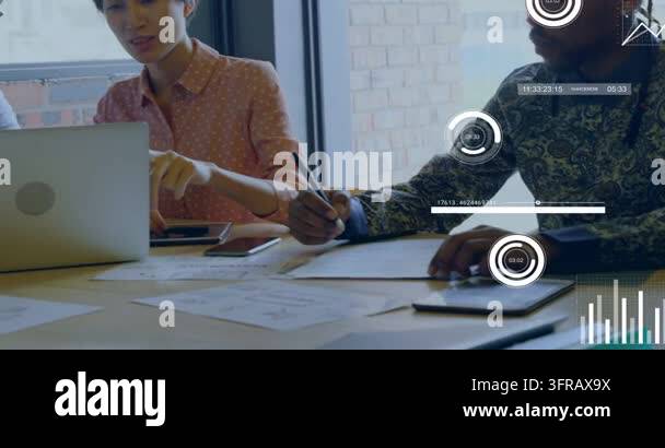 Team leaning in, woman pointing laptop, man taking notes, HUD charts ...