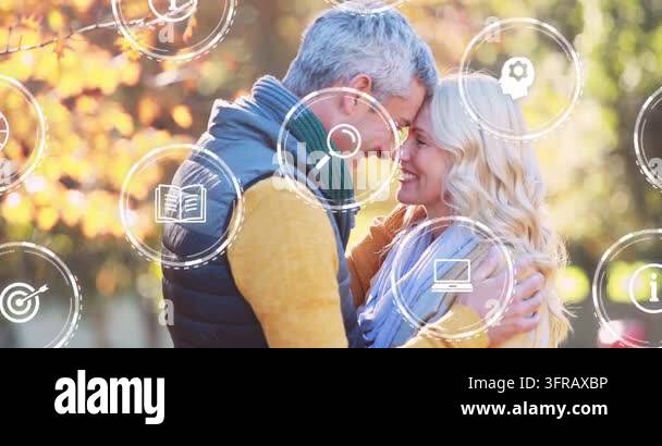Man holding woman touching foreheads in sunny park, icons appearing and ...