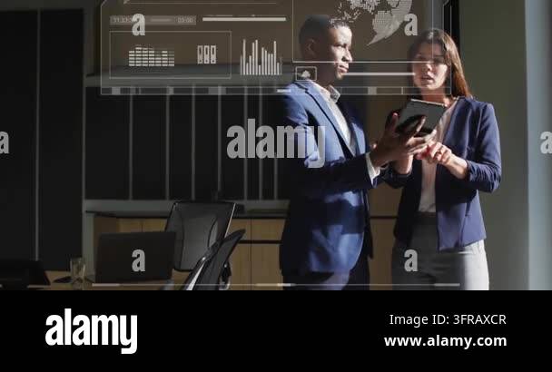 Team standing in meeting examining tablet, man tapping to call AR ...