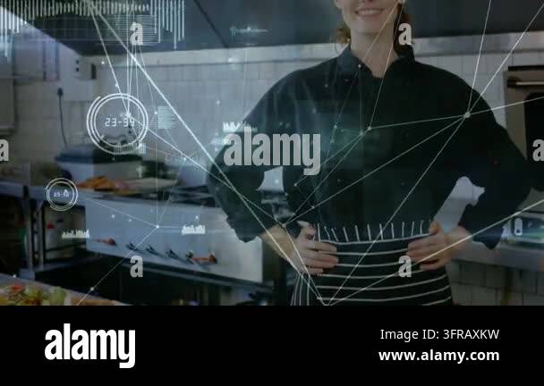 Chef turning and smiling as camera moving closer showing kitchen dishes ...