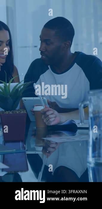 Vertical video: Lead man tapping tablet in tech meeting, causing icons ...