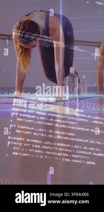 Vertical video: Woman pushing back into forward fold from hands in yoga ...