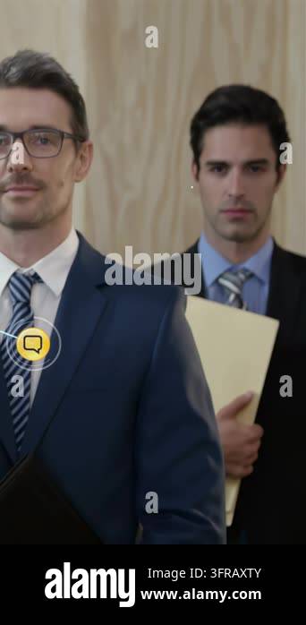 Vertical video: Two men standing, network icons emerging and expanding ...
