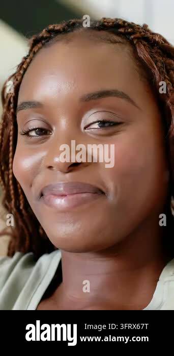 Vertical video: Woman smiling, AR filter activating, icons drifting ...