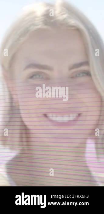 Vertical video: Woman moving squint into smile as focus clearing, lines ...