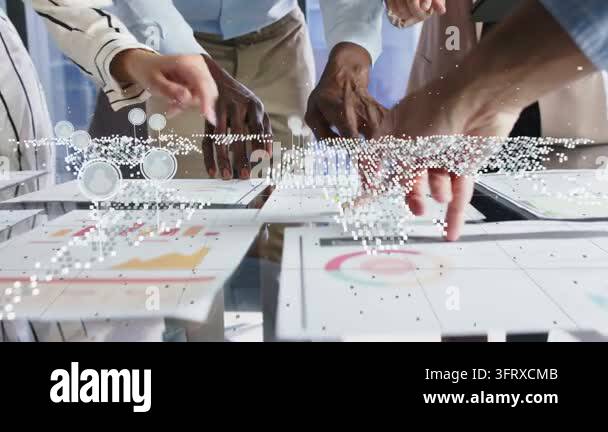 Business team tapping target chart on glass table, causing dotted map ...