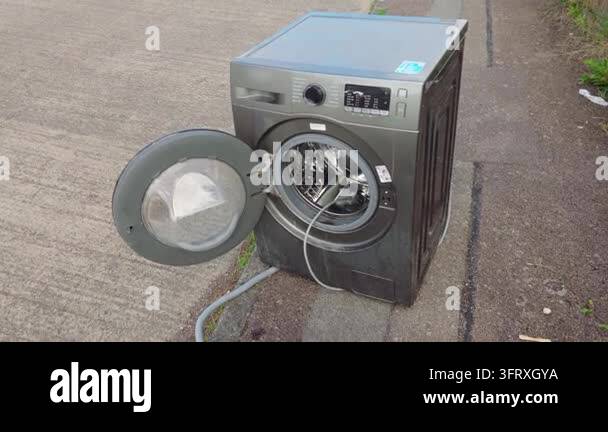 Front Loader Vector Graphics Free washing machine for pickup beside residential road. Used front ...