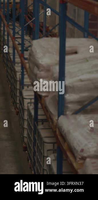 Pan causing AR overlay over warehouse, linking phone icons over workers ...