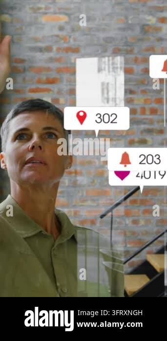 Vertical video: Raising hand woman calling floating icons on glass ...