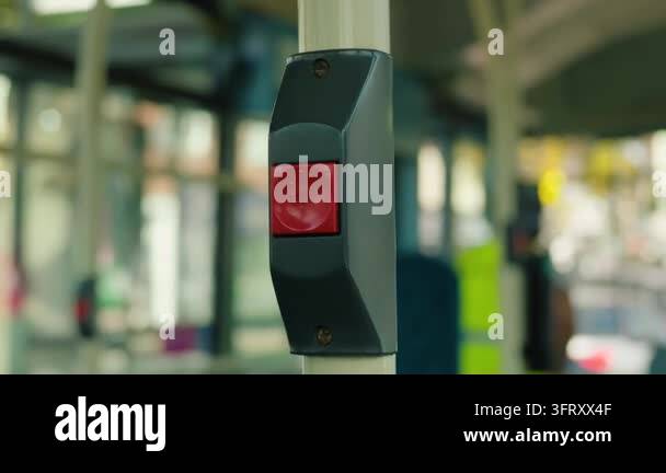 Bus stop request button inside modern electric city bus. Red passenger ...