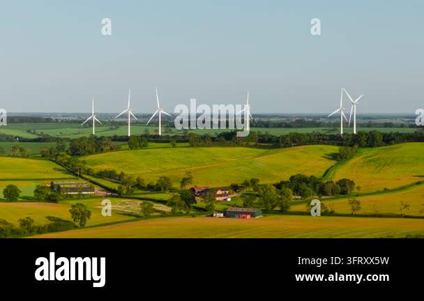 Video Generation Technology Wind turbines producing renewable electricity over rural landscape ...
