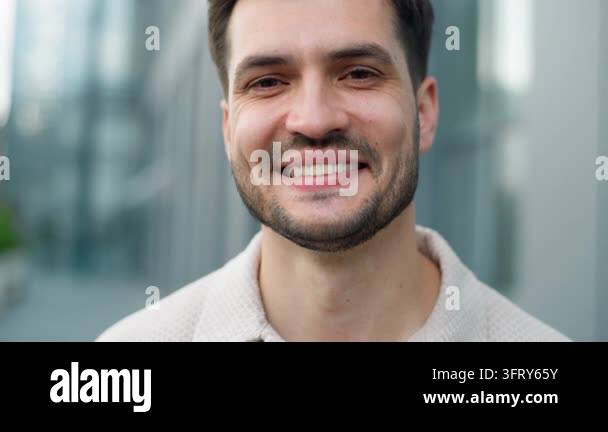Portrait happy young Caucasian business man smiling toothy looking at ...