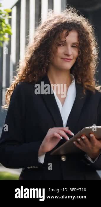 Caucasian business woman using digital tablet showing thumb up ...