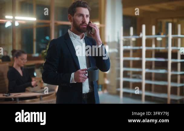 Multitasking serious Caucasian business man company owner talking ...