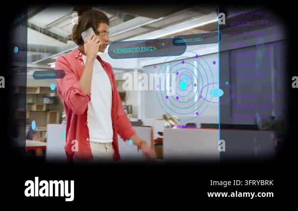 Man walking business loft on phone, showing device and explaining ...