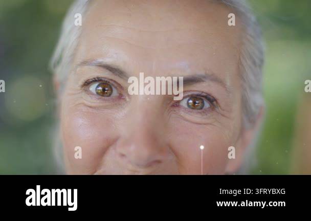 Senior woman slowly smiling while nodes popping and aligning over face ...