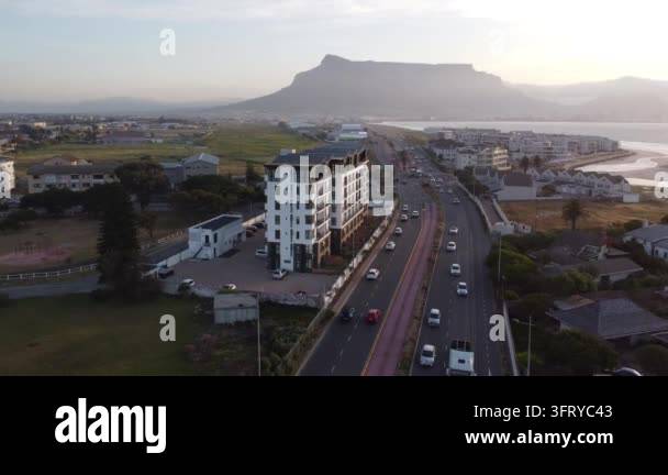 Aerial view of a modern building alongside a busy road with Table ...