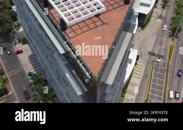 Aerial view of a modern building with a triangular rooftop and ...