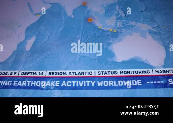 Camera shot computer monitor screen displaying global earthquake ...