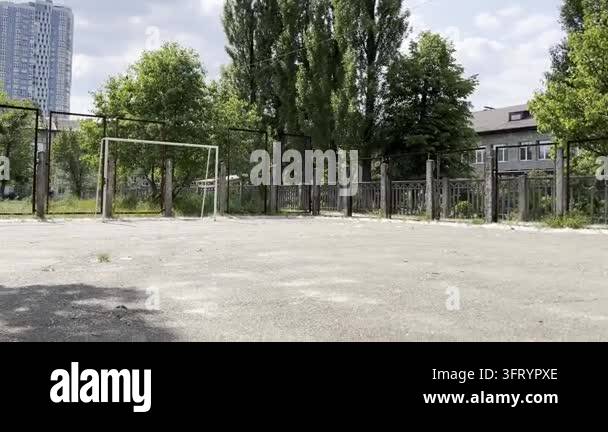 Teen football player practicing ball control and technique on outdoor ...