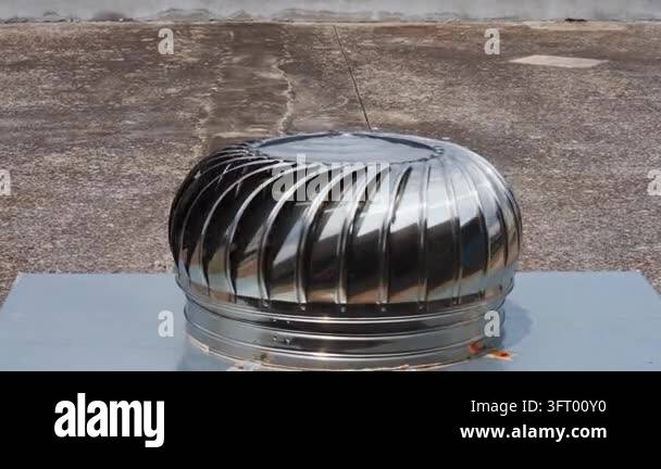 The metal ventilation hood installed on the roof rotates with the wind ...