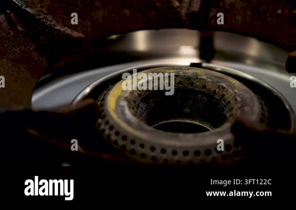 The blue flame of a gas stove burner symbolizes scenes of home cooking ...