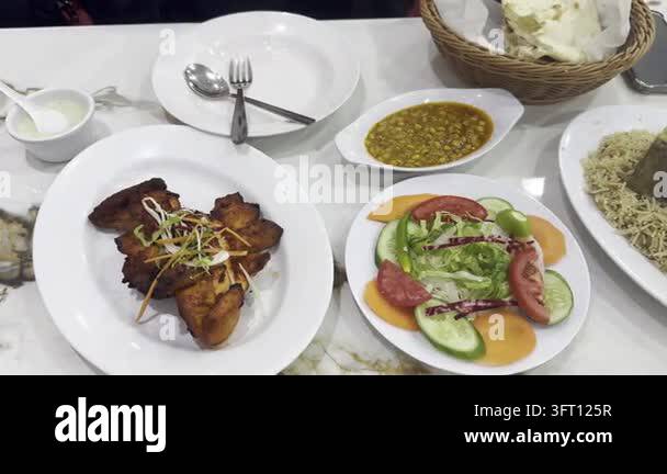 Pakistani food spread with rice and meat Stock Video Footage - Alamy