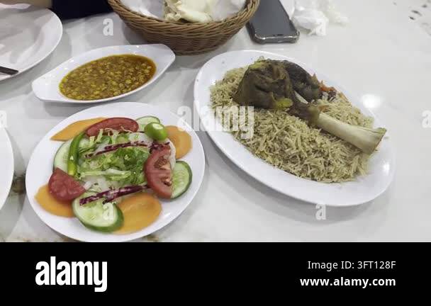 Pakistani food spread with rice and meat Stock Video Footage - Alamy
