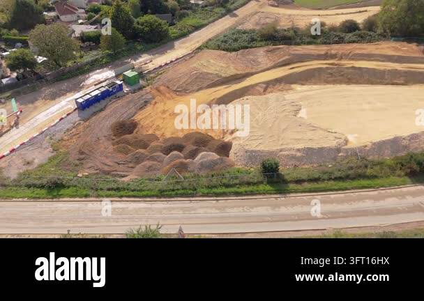 Sideways elevated drone movement of a field being used as an aggregate ...