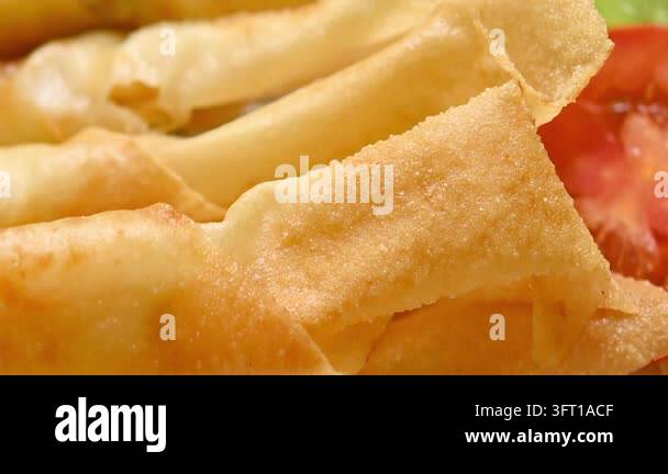 Traditional Asian food: Fresh and crispy fried spring rolls Stock Video ...