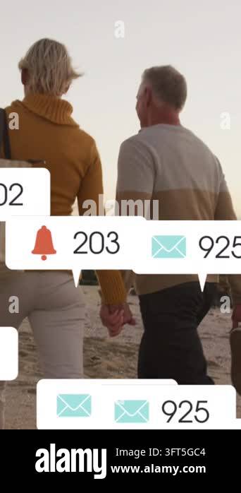 Animation of social media text and icons over caucasian couple on beach ...
