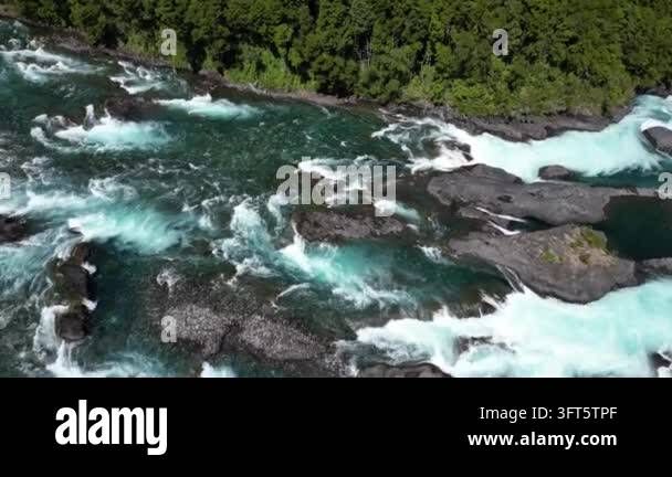 Fast Flowing Rivwer Aerial view of a wide, fast flowing river with white water rapids ...