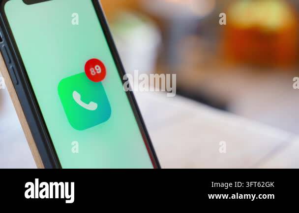Missed calls counter growing on phone app icon close-up. Notification ...