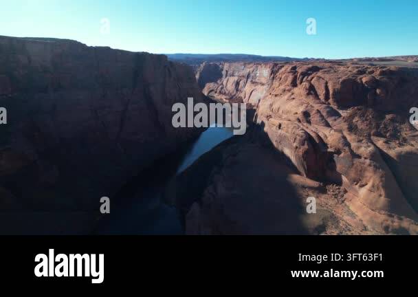 Winding Riger Aerial drone footage captures a wide view of a winding river flowing ...
