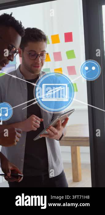 Vertical video: Two men tapping tablet by notes, initiating AR blue ...