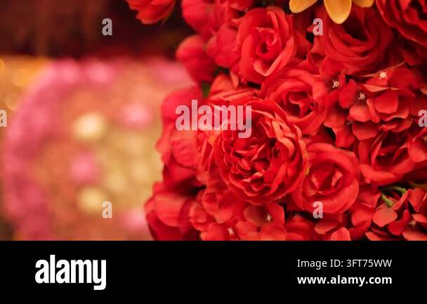 Red Indiand Close up of vibrant red rose decorations used for traditional Indian ...