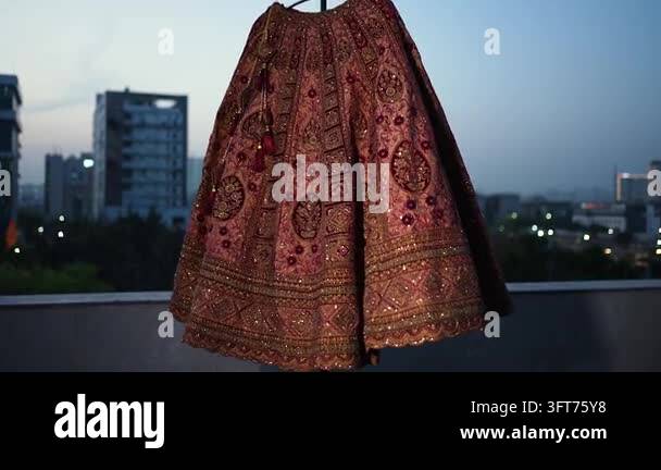 Red Indiand A traditional red and gold Indian wedding lehenga skirt displayed ...