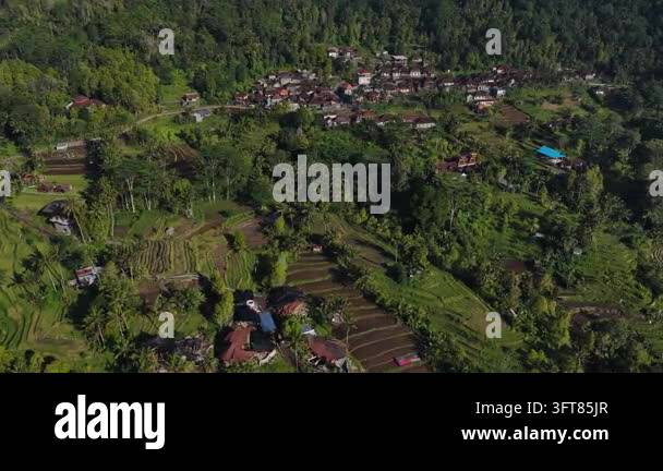 High-angle aerial view of terraced rice paddies and clustered hillside ...