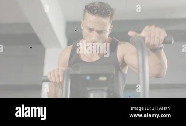 Man grasping handles and starting cardio in gym, fitness data tracking ...