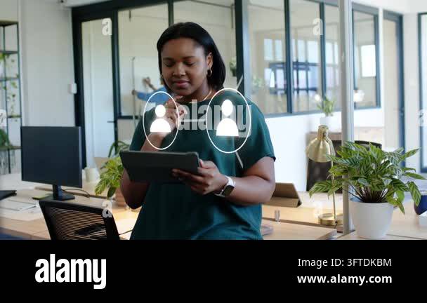 Woman tapping tablet, watching icons and data streams aligning with ...