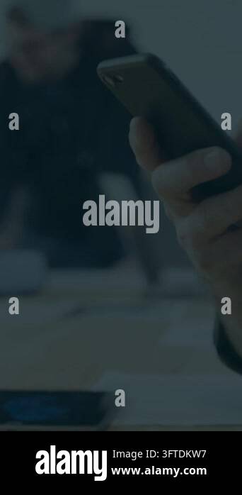 Vertical video: Lead scrolling phone in tech meeting, showing code ...