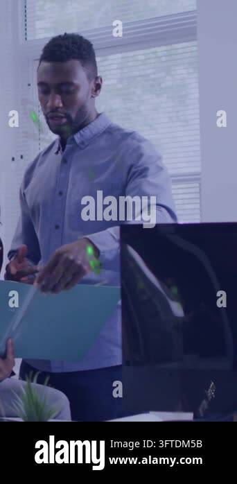 Vertical video: Man reviewing blue folder, pointing at office, green UI ...