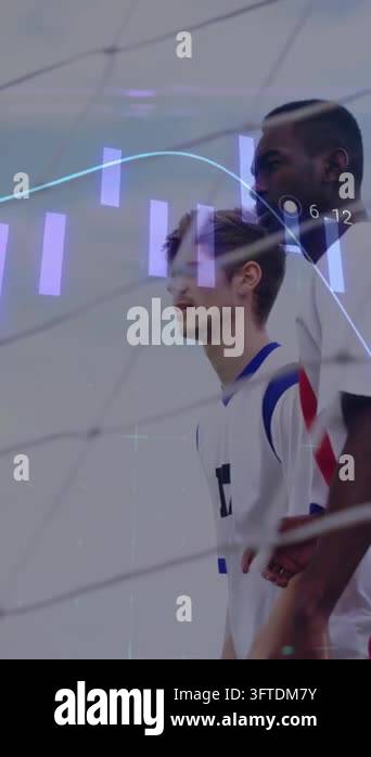 Vertical video: 2 soccer players vying at goal tracking cross as purple ...