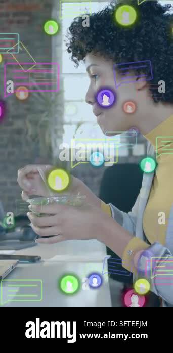 Animation of media icons over businesswoman using laptop and having ...