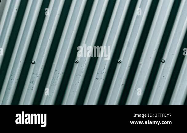 Close up view of a light green corrugated metal surface showing ...
