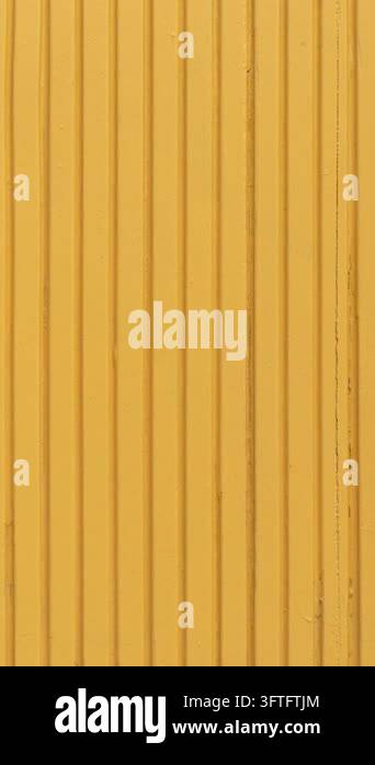 Detailed yellow wooden texture with vertical ribbed pattern creates a ...