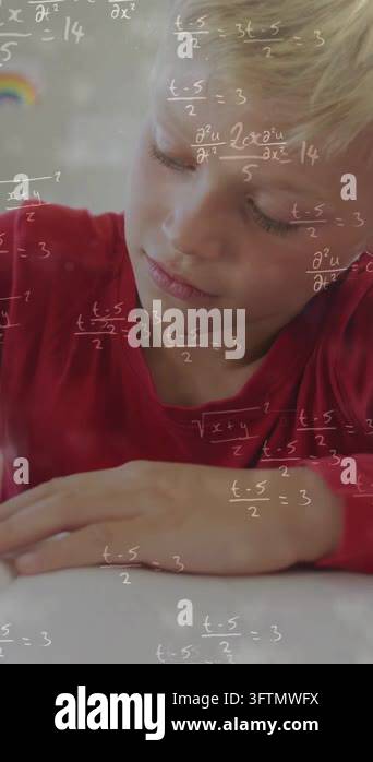 Vertical video: Boy gazing, tracing worksheet at desk, equations ...