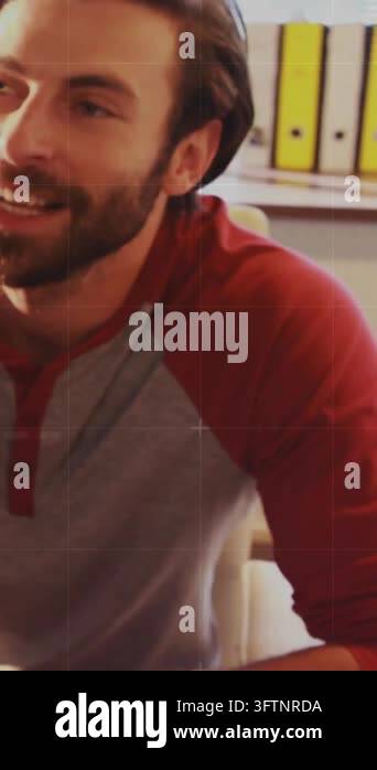 Vertical video: Animated business HUD appearing around laptop, worker ...