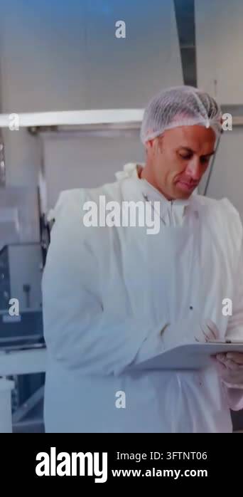 Vertical video: QC tech noting on clipboard while camera panning and ...