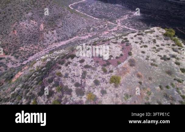 Aerial view of rocky terrain and winding path Stock Video Footage - Alamy